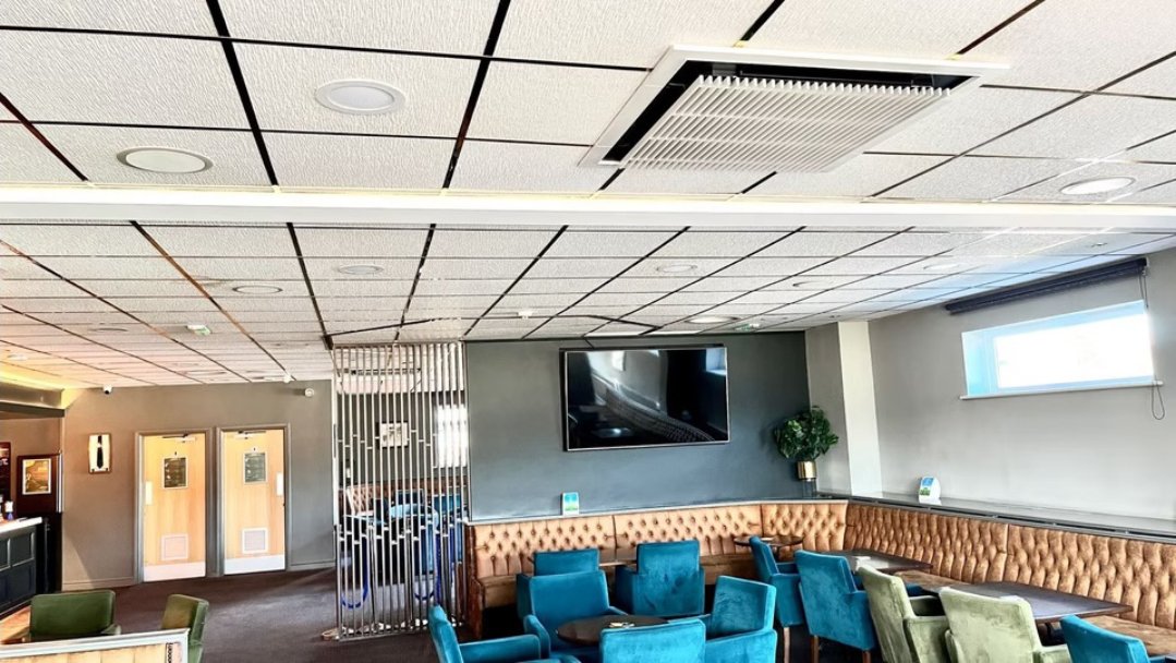 Ceiling cassette air conditioning unit in a commercial lounge